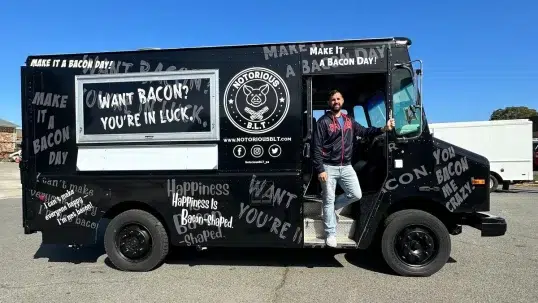 the owner of Notorious BLT standing in his new food truck